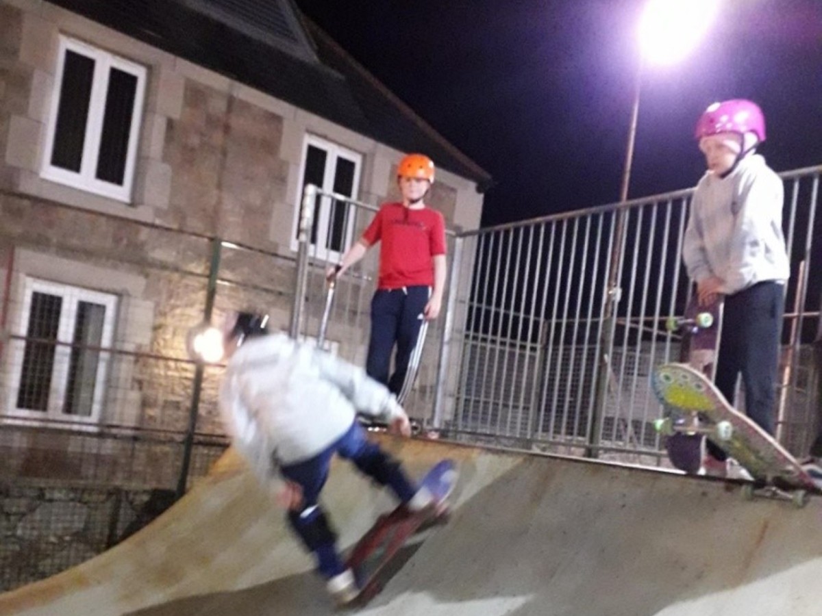 kids skating on skateboard ramp